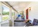 Screened-in porch with wooden flooring and white railings at 406 N Nichols St., Nichols, SC 29581