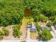 Aerial view showing house, pond, and trees at 406 N Nichols St., Nichols, SC 29581