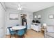 Small dining area with white table and four blue chairs at 501 S Ocean Blvd. # 308, North Myrtle Beach, SC 29582