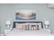 Bedroom with king-size bed, coastal art, and soft lighting at 501 S Ocean Blvd. # 308, North Myrtle Beach, SC 29582