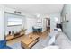 Living room with dining area, sofa and a TV at 501 S Ocean Blvd. # 308, North Myrtle Beach, SC 29582