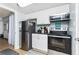 Small, well-appointed kitchen with white cabinets at 501 S Ocean Blvd. # 308, North Myrtle Beach, SC 29582
