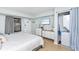 King bed, dresser, in-unit laundry, and beach views at 501 S Ocean Blvd. # 308, North Myrtle Beach, SC 29582