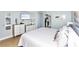 Bedroom with king bed, TV, dresser, and coastal decor at 501 S Ocean Blvd. # 308, North Myrtle Beach, SC 29582