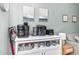White kitchen appliance station with coffee maker, air fryer, and toaster at 501 S Ocean Blvd. # 308, North Myrtle Beach, SC 29582