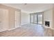 Living room with hardwood floors, a fireplace, and sliding glass doors at 47 Shadow Moss Pl. # 47, North Myrtle Beach, SC 29582