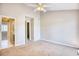 Spacious bedroom with carpet, ceiling fan and bathroom access at 47 Shadow Moss Pl. # 47, North Myrtle Beach, SC 29582