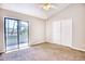 Bright bedroom with vaulted ceiling, ceiling fan, and private balcony access at 47 Shadow Moss Pl. # 47, North Myrtle Beach, SC 29582