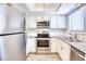 Modern kitchen with stainless steel appliances and granite countertops at 47 Shadow Moss Pl. # 47, North Myrtle Beach, SC 29582
