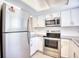 Updated kitchen, featuring stainless steel appliances and white cabinets at 47 Shadow Moss Pl. # 47, North Myrtle Beach, SC 29582