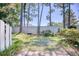 Landscaped backyard with a privacy fence and lush green grass at 47 Shadow Moss Pl. # 47, North Myrtle Beach, SC 29582
