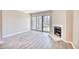 Bright living room featuring a fireplace and access to a patio at 47 Shadow Moss Pl. # 47, North Myrtle Beach, SC 29582