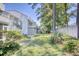 Landscaped backyard with tall trees and privacy fence at 47 Shadow Moss Pl. # 47, North Myrtle Beach, SC 29582