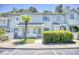Attractive two-story townhome with landscaping and a walkway at 47 Shadow Moss Pl. # 47, North Myrtle Beach, SC 29582