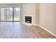 Living room with fireplace and sliding glass doors leading to a patio at 47 Shadow Moss Pl. # 47, North Myrtle Beach, SC 29582
