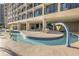 Relaxing lazy river pool with colorful water features at 4800 South Ocean Blvd. # 1114, North Myrtle Beach, SC 29582