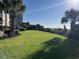 Expansive grassy area with landscaping and ocean views at 201 76Th Ave. N # C3, Myrtle Beach, SC 29572