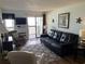 Relaxing living room with leather furniture and ocean views at 201 76Th Ave. N # C3, Myrtle Beach, SC 29572