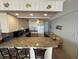 Galley kitchen boasts granite countertops and white cabinetry at 201 76Th Ave. N # C3, Myrtle Beach, SC 29572