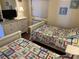 Two twin beds, dresser, and TV in a bedroom at 201 76Th Ave. N # C3, Myrtle Beach, SC 29572