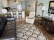 Bright living room with leather sofa and view into kitchen at 201 76Th Ave. N # C3, Myrtle Beach, SC 29572