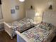 Two twin beds with coastal decor in a bright bedroom at 201 76Th Ave. N # C3, Myrtle Beach, SC 29572