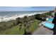 Aerial view of pool, beach access and picnic tables at 201 76Th Ave. N # C3, Myrtle Beach, SC 29572