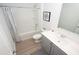 Clean bathroom with a shower/tub combo and gray vanity at 332 Jeff Waters Circle, Longs, SC 29568