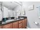 Modern bathroom with double sinks, granite countertops, and a shower at 647 Riverward Dr. # 647, Myrtle Beach, SC 29588