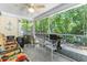 Relaxing screened porch with patio furniture and wooded views at 647 Riverward Dr. # 647, Myrtle Beach, SC 29588