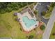Community pool with lounge chairs and umbrellas at 647 Riverward Dr. # 647, Myrtle Beach, SC 29588