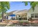 Backyard with patio, screened porch, and ample green space at 647 Riverward Dr. # 647, Myrtle Beach, SC 29588