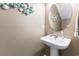 Small powder room with pedestal sink and seashell decor at 647 Riverward Dr. # 647, Myrtle Beach, SC 29588