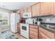 View of kitchen with white appliances and light wood cabinets at 647 Riverward Dr. # 647, Myrtle Beach, SC 29588