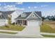 New construction home with gray siding, red door, and two-car garage at 2914 Spain Ln., Conway, SC 29527