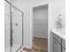 Bathroom with a walk-in shower and closet at 289 Sandridgebury Dr. # 65, Little River, SC 29566