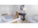 Bedroom with daybed, desk, and adjacent hallway at 289 Sandridgebury Dr. # 65, Little River, SC 29566