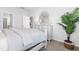 Bedroom with large bed, dresser and plant at 289 Sandridgebury Dr. # 65, Little River, SC 29566
