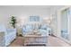 Living room with light blue couch, wooden coffee table, and sliding glass doors at 289 Sandridgebury Dr. # 65, Little River, SC 29566