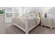 Bright bedroom with a queen-size bed, nightstands, and window coverings at 289 Sandridgebury Dr. # 65, Little River, SC 29566
