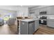 Modern kitchen with gray cabinets, white countertops, and kitchen island at 289 Sandridgebury Dr. # 65, Little River, SC 29566