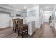 Modern kitchen with gray cabinets, white countertops, and kitchen island with seating at 289 Sandridgebury Dr. # 65, Little River, SC 29566