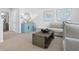 Living area with sectional sofa, coffee table, and blue cabinet at 289 Sandridgebury Dr. # 65, Little River, SC 29566