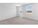 Spacious bedroom with neutral carpeting and large windows at 289 Sandridgebury Dr. # 65, Little River, SC 29566
