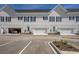 Rear view of townhouses with attached garages and parking at 852 Iris St. # F, Myrtle Beach, SC 29577
