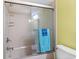 Bathroom with a shower/tub combo and a sliding glass door at 4301 S Ocean Blvd. # 1C, North Myrtle Beach, SC 29582