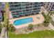 Condo complex pool with surrounding lounge chairs at 4301 S Ocean Blvd. # 1C, North Myrtle Beach, SC 29582