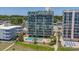Aerial view of beachfront property with pool and surrounding buildings at 4301 S Ocean Blvd. # 1C, North Myrtle Beach, SC 29582