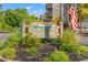 Ocean Greens community entrance sign with American flag at 1500 Cenith Dr. # B-402, North Myrtle Beach, SC 29582