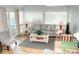 Relaxing living room with sofa, windows, and access to balcony at 351 Lake Arrowhead Rd. # 4-315, Myrtle Beach, SC 29572